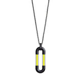 Black minimalistic ring chain with an oval centerpiece assembled form four parts: two black matt metal U-shaped elements interconnected with two thin lines of pure yellow pigment set in thick quartz tubes.