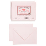 An image of the front and back of a pale pink envelope. Above is an image of a stack of pink envelopes. On the top of stack is the Original Crown Mill branded brown and red seal which features a crown and an Old English font.