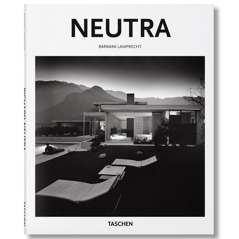 White book cover with black and white photograph of a modernist building and lawn with lawn chairs and pool in front of a mountain range. Title in black sans serif letters at top