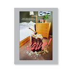 Gray book cover with a photograph of a tree stump with an ax and other tools on it in a carpeted bedroom