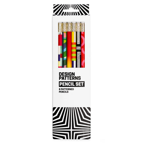White and black box with dynamic angular pattern. Window in box shows six colorfully patterned pencils