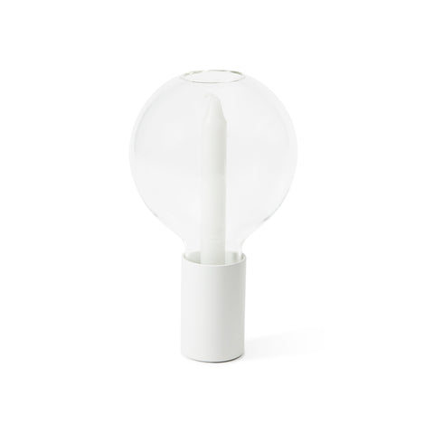 Candleholder designed to resemble the shape of a lightbulb. Clear glass has on opening on the top, it is inserted in a metal base that holds a white candle. 
