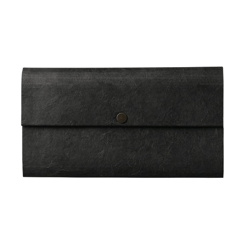A rectangle shaped envelope style wallet made out of a cloth material and featuring a brass snap closure.