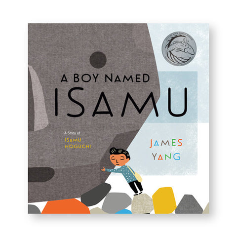 Book cover featuring an illustration of a small child hugging a giant boulder. Text overlaid: "A Boy Named Isamu"