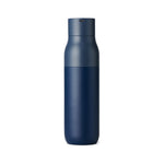 A photo of the LARQ Bottle in Monaco Blue. The back of the bottle faces the viewer exposing the camouflaged usb port built into side of the bottle cap.