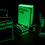 Several copies of "Making Design" book in a dark room showing their glow in the dark properties
