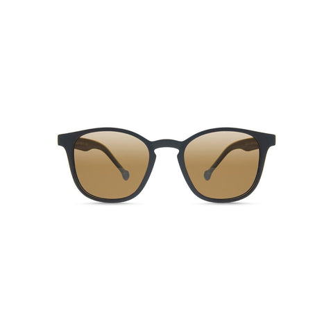 Side angle view of the Ruta Sunglasses Black/Caramel, which have black, rounded square-rectangular frames, and caramel lenses.
