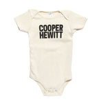 Off-white onesie with black bold text that reads 'COOPER HEWITT'