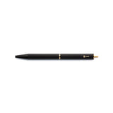The Black Brassing Portable Ball Point Pen has flat sides for grip, a brass-colored scalloped center seam, a small, brass-colored, ystudio logo, and a narrow, brass end.