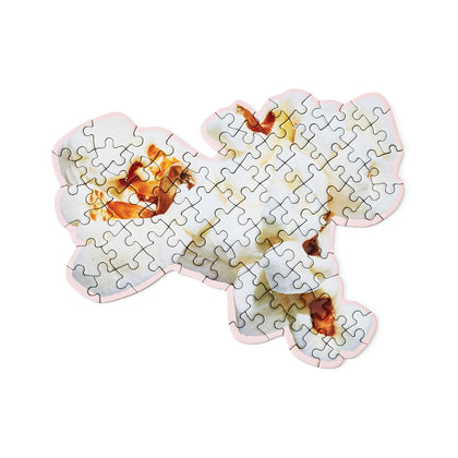 Jigsaw puzzle featuring a photo of a piece of popcorn, in the shape of a piece of popcorn.