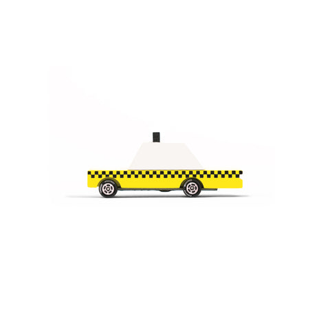 Side view of a small, geometric wooden taxi. Yellow body with a black checker pattern.