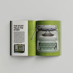 Interior book spread with an essay titled "The Stuff Tells the Story" alongside an image of a mint-green Hermes typewriter 