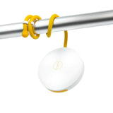 White, disk-shaped light hanging by its' flexible, yellow arm, which is wrapped around a from a metal pole.