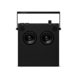 Black portable speaker with visible brand name on a white background