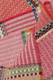 Close-up of a colorful woven fabric with various patterns and colors.