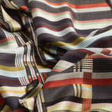 Close-up of multicolored striped fabric with a checkered pattern