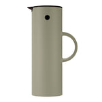 Cylindrical, Soft Moss vacuum jug with a thin, semi-circle handle, a black lid with a beak-shaped pour spout, and a black button "eye."