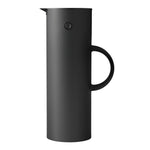 Cylindrical, Soft Black vacuum jug with a thin, semi-circle handle, a black lid with a beak-shaped pour spout, and a black button "eye."