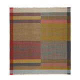 Plaid patterned rug with a mix of colors on a white background