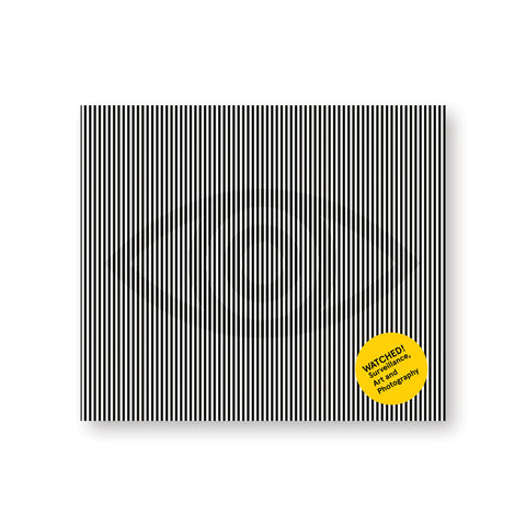 Horizontal book cover with black and white vertical stripes vaguely concealing icon of an eye in gray. Yellow dot near bottom right has title in black sans serif letters