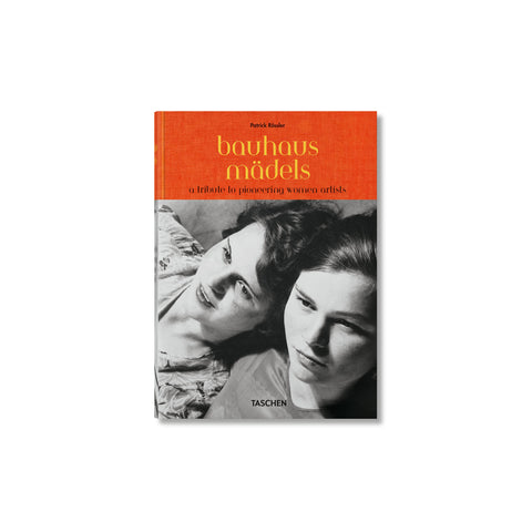 Book cover with an orange band across the top with the title in yellow lowercase serif font. Below is a black and white photo of two women leaning on to each other, looking off to the side, cropped at their shoulders. 