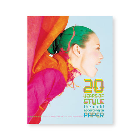 Book cover featuring a photo of a model with green hair and magenta clothing screaming, in profile. Stacked, colorful text at bottom right reads "20 Years of Style The World According to Paper"