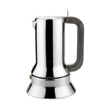 Side shot of mirror-polished espresso maker with copper handle on white background.