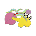 A brooch with an abstract floral composition colored in yellow, green, pink, blue, black, and white.