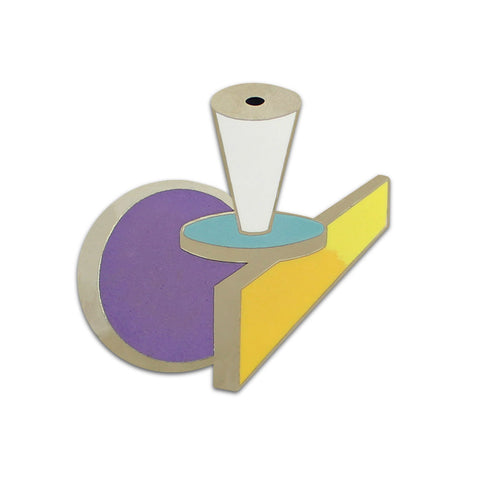 A brooch with a teapot shape surface, decorated with yellow, white, blue and purple glossy enamel. 