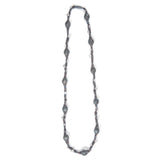 Long necklace designed from iridescent thread interwoven with small glass beads.