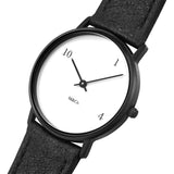 Front angle view of the 10-one-4 Watch. Around the face there are only three numbers, 10, 1, and 4, in black serif font. Aside from the numbers, the watch is minimal and classic with a black band, white face, black and thin black minute and hour hands. The black, serif M&Co logo is small below the hands.