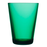 One of a pair of tall, emerald tumbler glasses with a thick, flat bottom and elegant, flared sides on a white background.