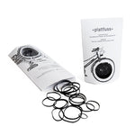 A white package with black rubber bands in several sizes, made with recycled bicycle tires. 