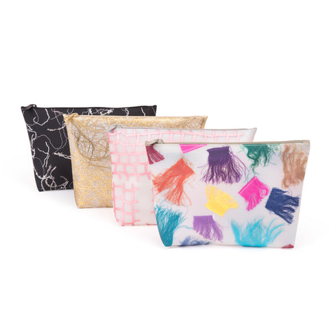 Four translucent cosmetic bags with scrap fabric as detailing