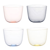 4 transparent water glasses in magenta, gray, blue, and yellow.