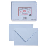 An image of the front and back of a light blue envelope. Above is an image of a stack of blue envelopes. On the top of stack is the Original Crown Mill branded brown and red seal which features a crown and an Old English font.