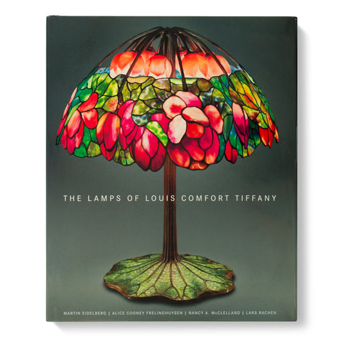 Book cover shows a stained glass lamp with pink roses, the lamp base is green with a leaf pattern