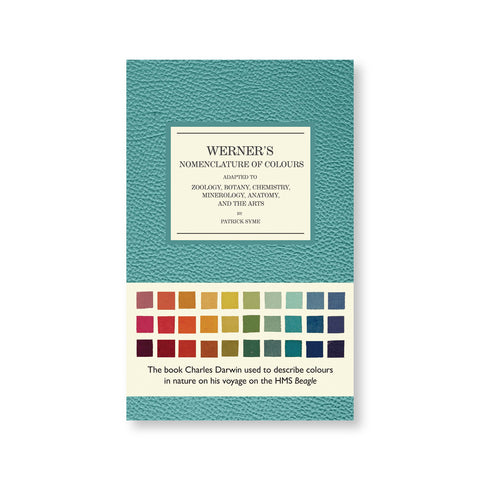 Greenish blue textured book cover with title information in a white field with black serif letters. cream colored belly band near bottom with colorful square swatches and descriptive text in modern black font