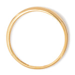 A tubular gold bangle that gradually thickens toward the front of the bracelet.