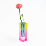 A gif of the bud vase rotating to show the different colors that emit from it.