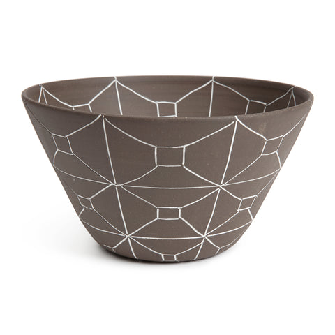 Large matte brown bowl that flares outward toward the top and has a rectangular etched out pattern in white.