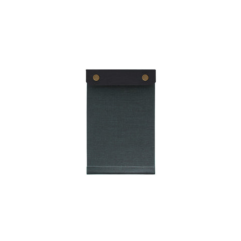  Palm-sized refillable notepad with snap closure for securing paper. Navy blue color is featured.