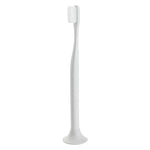 soft white toothbrush with matching color, round shaped stand.
