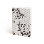 Printed in brown ink against a white background, the front of a card is covered in a lattice pattern. Layered over the lattice and bleeding off the edges, are two branches sprouting crysanthemum blossoms.