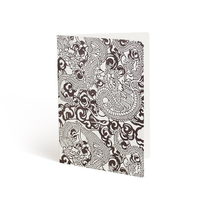 Printed in brown ink against a white background, the front of a card is covered in a cloud pattern. Illustrations of dragons are layered over the clouds and bleeding off the edges.