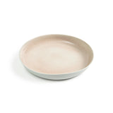 A medium-sized plate featuring a beige glazed interior and white matte exterior. The rim of the plate is extended upward allowing for a deep dish styled plate good for gravy and other runny foods.