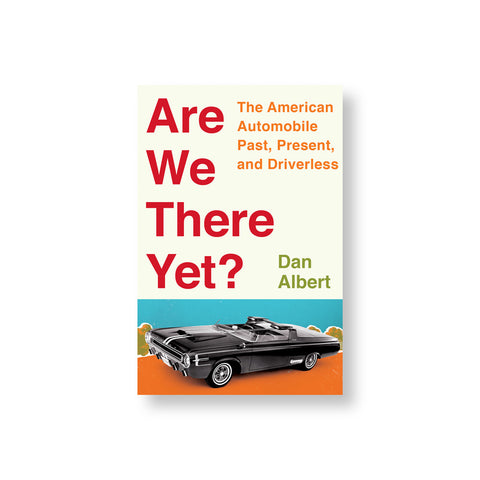 Beige book cover with vertically stacked title in red letters to the left of subtitle and author name in orange and green. Below is an image of a sleek black car on an orange road