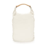 White backpack with flexible roll-top closure and a tan leather handle