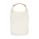 White backpack with flexible roll-top closure and a tan leather handle