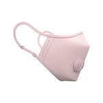 A face mask, in light pink and made of a synthetic material, features light pink elastic ear loops, a seam at the nose allowing for a close fit, and two round valves allow for improved air flow.